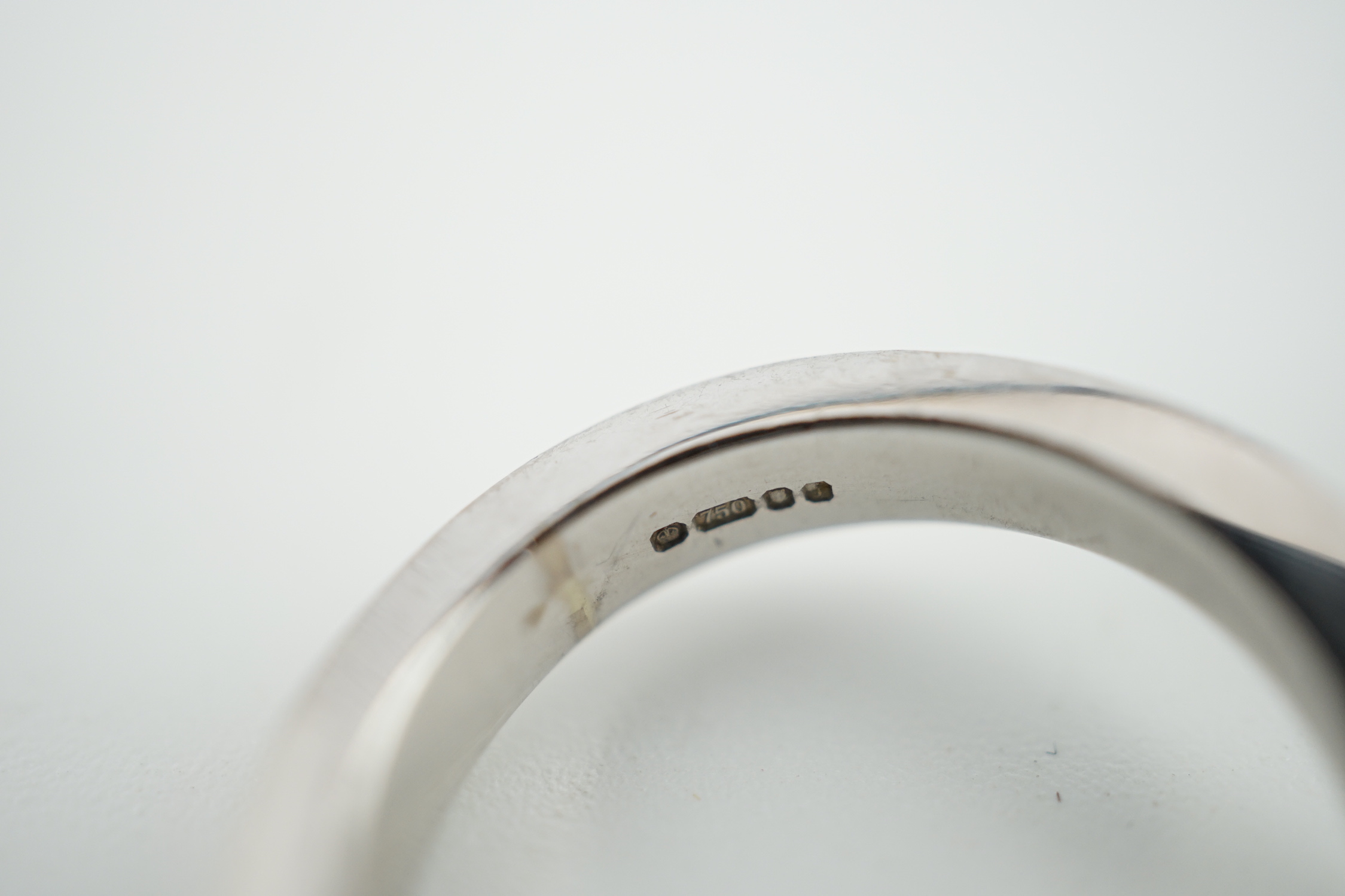 A modern 18ct white gold and solitaire marquise cut diamond set ring